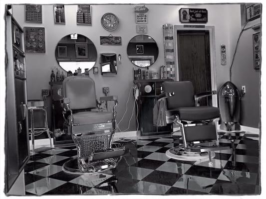 Two chairs, one barber.