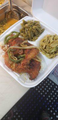 Baked chicken over white rice.  Seasoned cabbage & homestyle green beans for the sides.