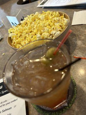 Old fashioned and popcorn at the bar.