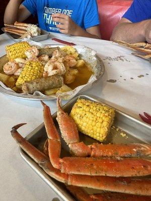 Crab legs, Boiled Eggs, corn, Sausage and potatoes in cajun BUTTER!