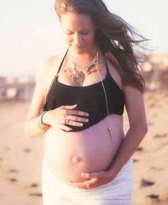 Woman holding her pregnant belly