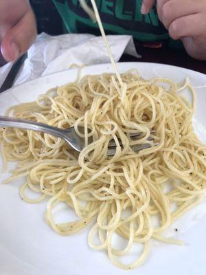 Kid's spaghetti with butter and cheese.