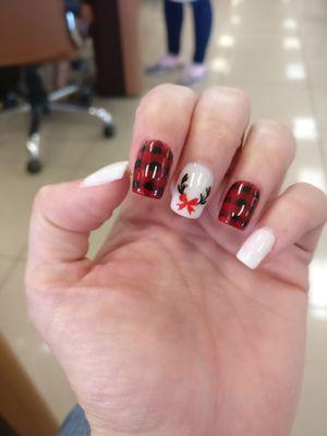 My Christmas nails. David painted the plaid and the reindeer design by hand!