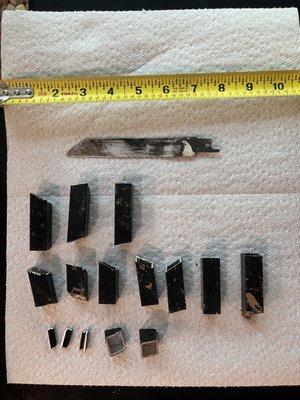 Pieces of metal found on day 1 after installation.  Most of these, including the saw blade, were pulled from our puppy's mouth.  :(