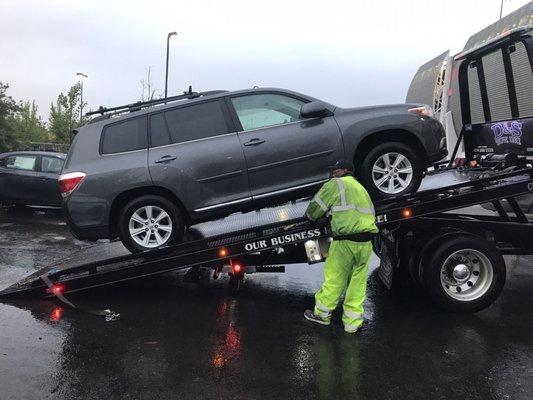 Freddie of D and S Towing unloading our car. Hard worker for sure.