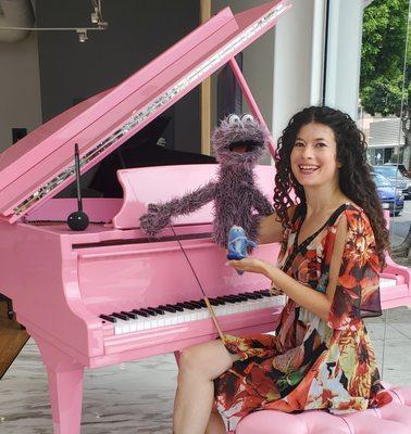 A pink piano and puppet helpers: Toodles and Eddie help teach lessons to young students--and the young at heart.