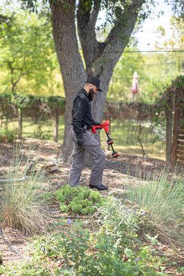 Using advanced locating technology to trace a pipe that is leaking in the yard.