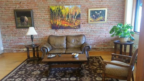 Comfortable waiting area, surrounded by local artist art work.