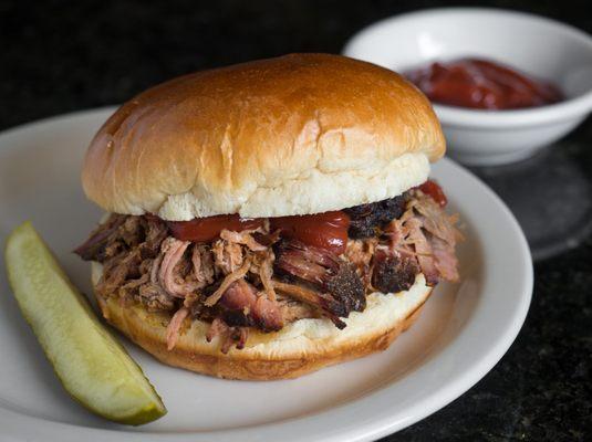 Our house specialty pulled pork sandwich is smoked right here!