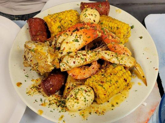 Crab boil with sausage, shrimp, corn and potatoes.