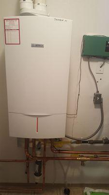 Bosch Greenstar 151 Combination boiler. It is about 1/3 the size of my old dinosaur boiler. Plenty of hot water.