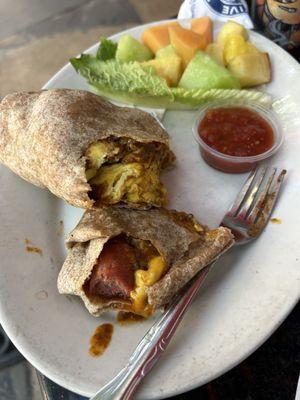 2. Polish Sausage, Chili, and Egg Burrito (on a dirty plate with spoiled chili)