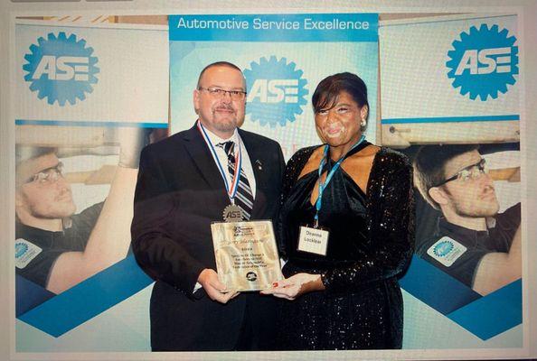 JERRY and Deanna accepting The ASE Master Technician Of the year Awards 11/2022