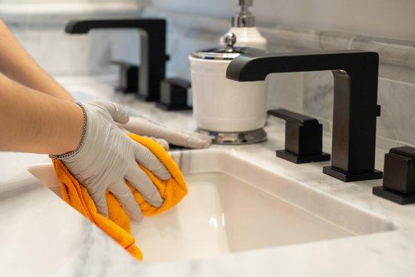 Our crew cleans around the faucet and sink, remove soap scum and toothpaste