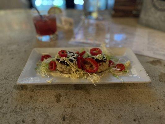 Crab cakes with a blackberry gin and tonic