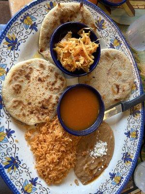 Pupusas, cabbage, tomato sauce, rice and beans.