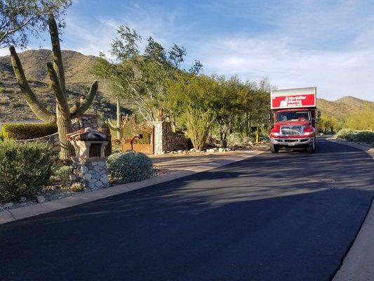 NorthStar Moving's Biodiesel truck driving along a beautiful desert road.