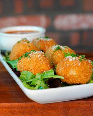 NEWCrispy Arancini. Golden balls of cheesy risotto.