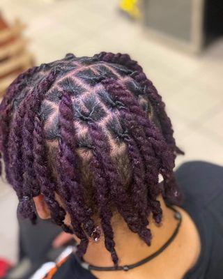 Locs were colored plum purple, then retwisted with two strand twist added.