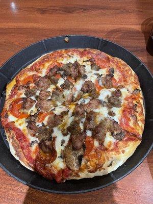 Small pepperoni, sausage, meatball and mushroom pizza