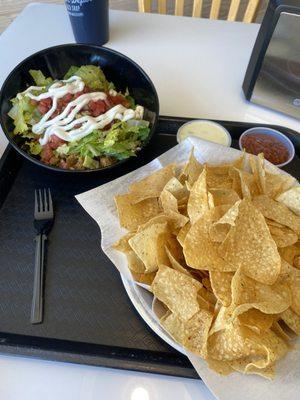 Burrito Bowl and a side of Chips with Salsa and Queso