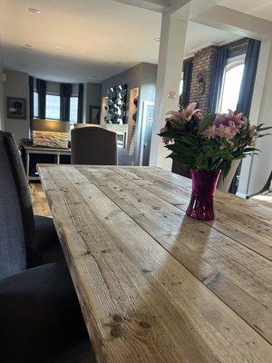 Dining room table view into living room