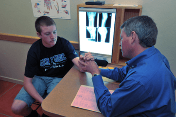 Dr. Butler assisting a patient.