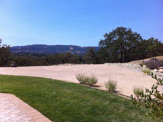 Lawn, dry river bed, DG area for extra tables (and dog rally training)