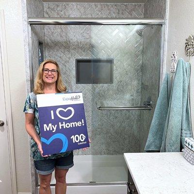 100% Satisfied customer after a beautiful new walk-in shower remodel.