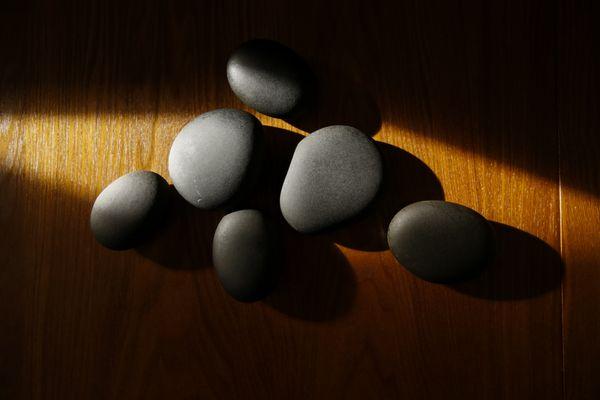 Hot stone massage is great for warming the muscles and release deep tension.