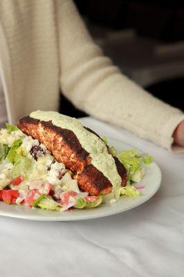 Grilled Salmon with sesame ginger or dill dijonaise sauce. Served over a Greek Salad