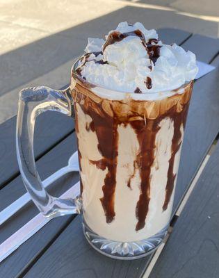 Immense chocolate shake. The chocolate sauce is layers inside the glass, not spilling onto the outside. Spoon and straw recommended.