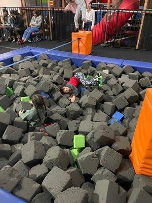 Foam pit with obstacles to get over