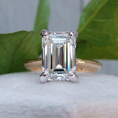 Emerald cut lab grown diamond solitaire style engagement ring.