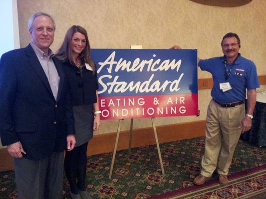 Mark Korte, American Standard Vice President of Sales with Kendra & Kirk Buscho.