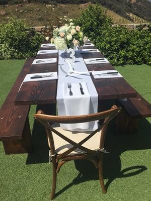 Farm tables and cross back chairs dress up any venue.