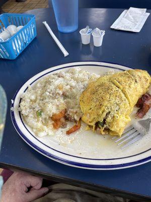 Western omelet with sausage bacon onions peppers tomatoes and cheese. Oh my goodness it is so good.