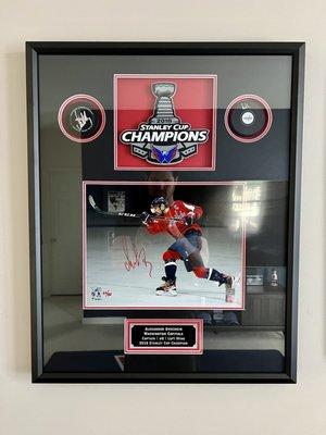 Alex Ovechkin signed photo; 2 signed pucks; Stanley Cup Champions Logo; and custom name plate.