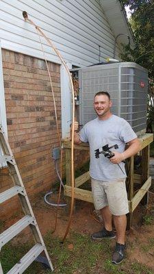 Zack, working on installing a Condenser