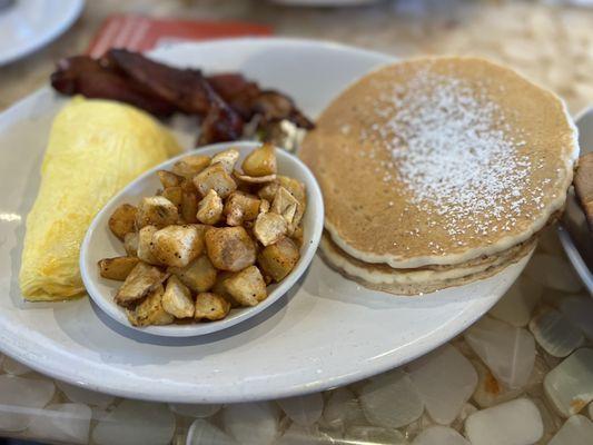 Pancakes, potatoes, "scrambled eggs w/ cheese & bacon