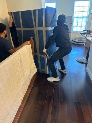 Carrying a heavy dresser in a town house