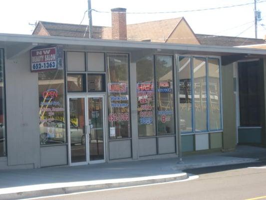 The front of the salon, with some pricing shown on the windows.