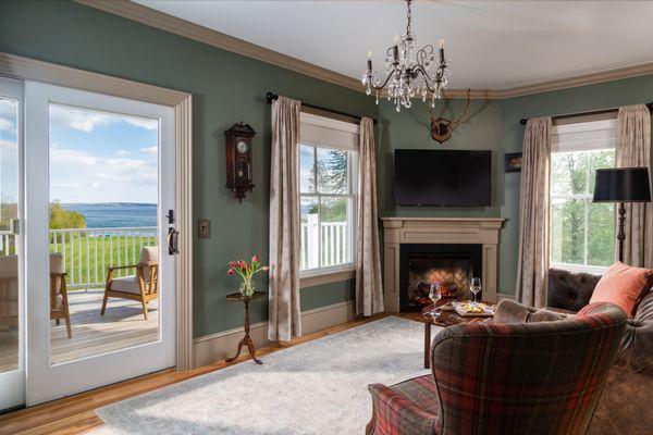 The sitting room in the Amos Suite with a private deck overlooking the Penobscot Bay.