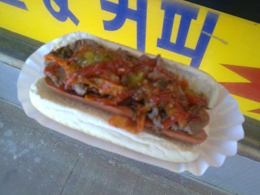 Split hotdog, with bulgogi, relish, kimchi, and ketchup.