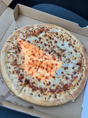 Small cheese pizza! That weird orange spot in the middle is the setting sun shining through my car window.