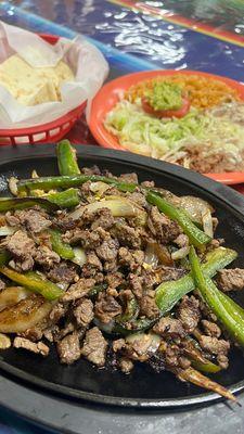 Beef fajitas with grilled onion and jalapeño