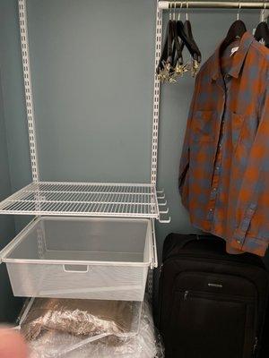 Spacious closet with lotsa shelf space, etc