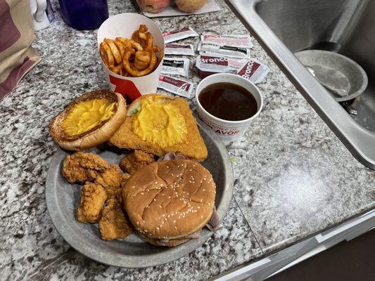 Roast beef, chicken nuggets, fish n cheddar , curly fries and a side of Ajou