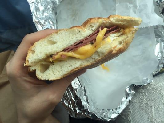 Pastrami egg and cheese on a roll