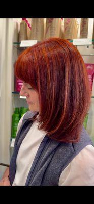 Stunning vivid red hair done by the talented Kelly.